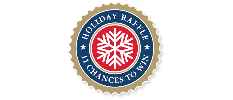 A circular badge with a gold scalloped border, navy blue ring with white text reading "HOLIDAY RAFFLE" and "1 IN CHANCES TO WIN," and a red center containing a white snowflake.