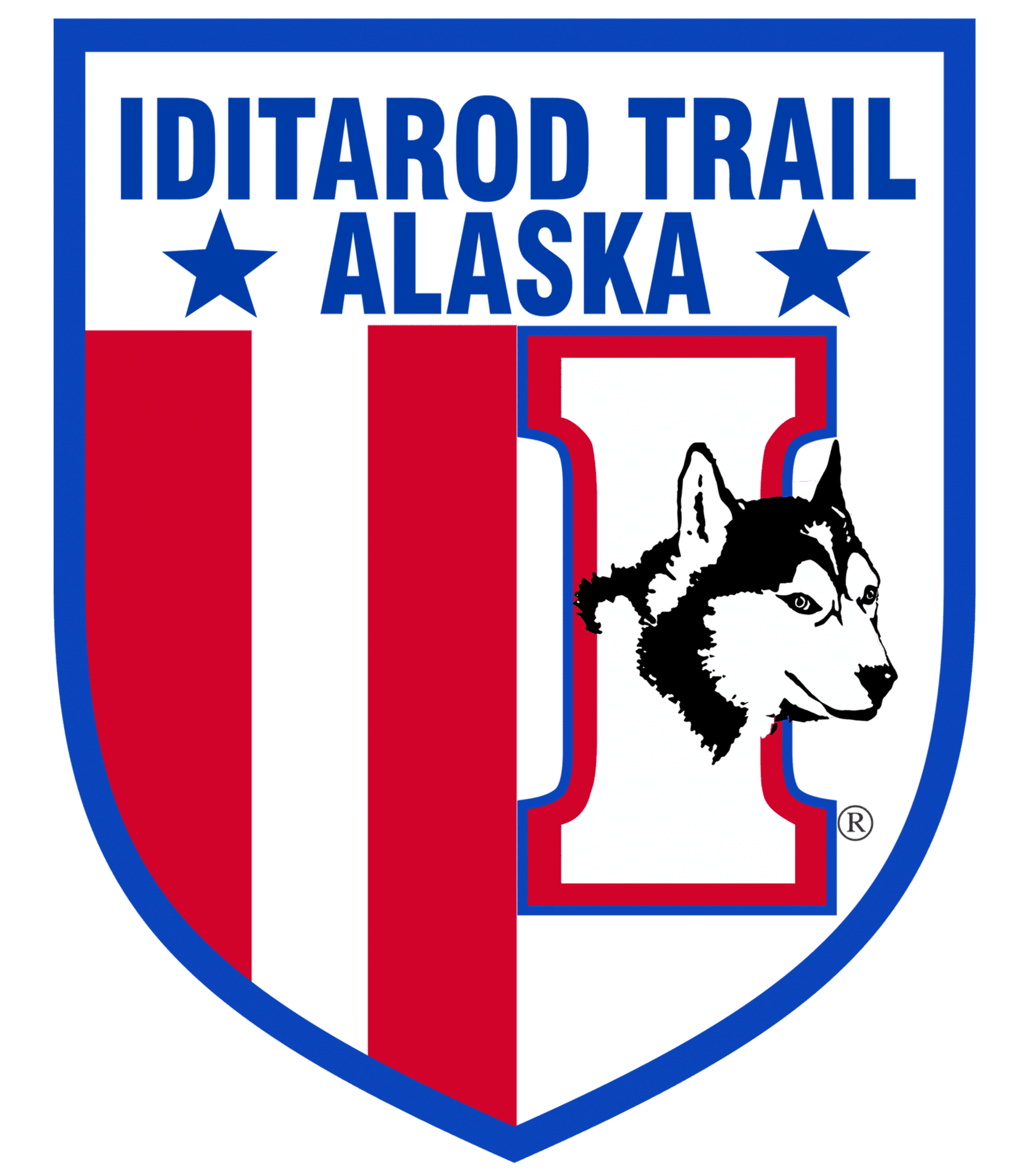 Iditarod Trail Alaska logo with shield design, red and blue colors, featuring a Husky dog head