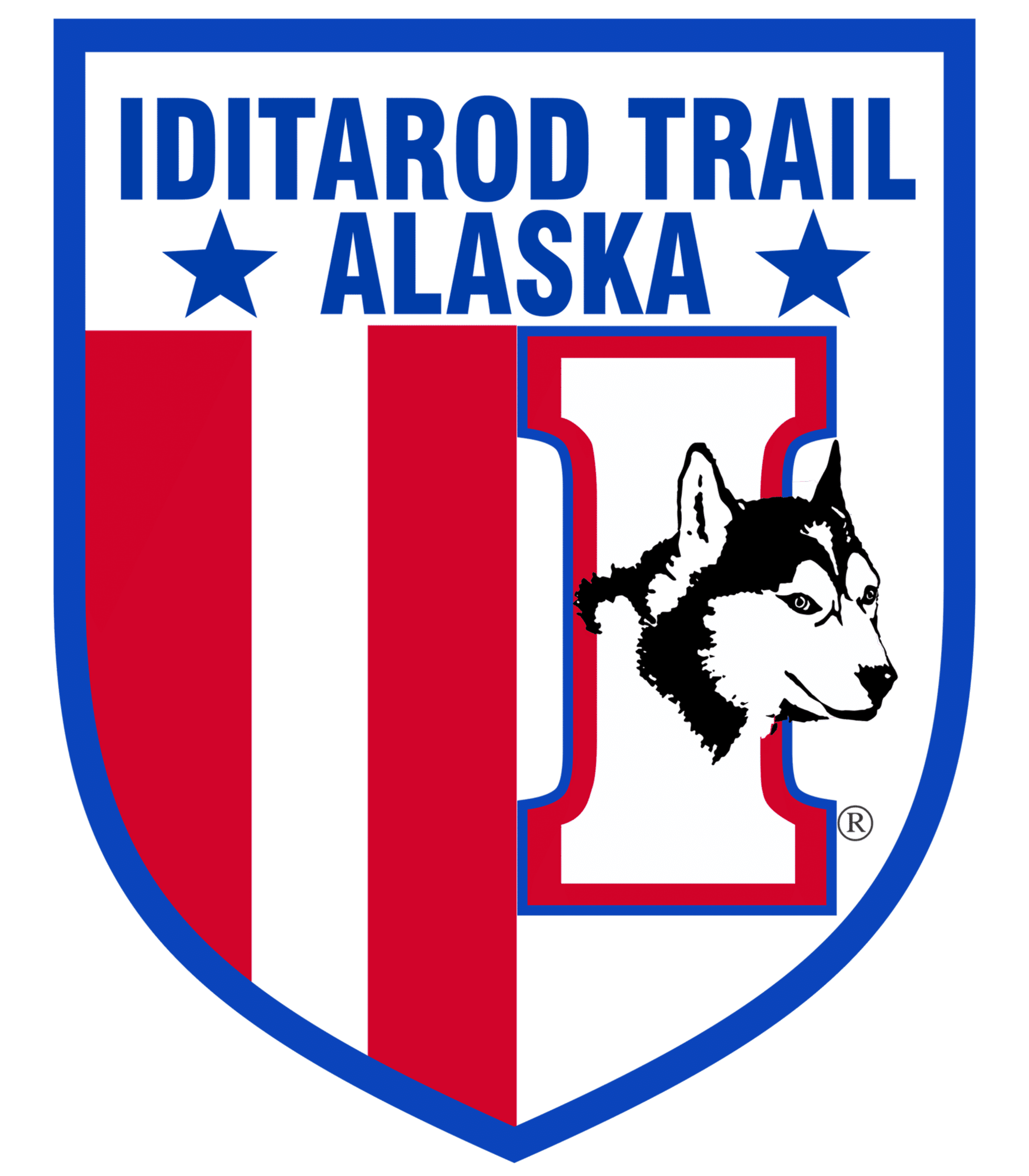 Iditarod Trail Alaska logo with shield design, red and blue colors, featuring a Husky dog head