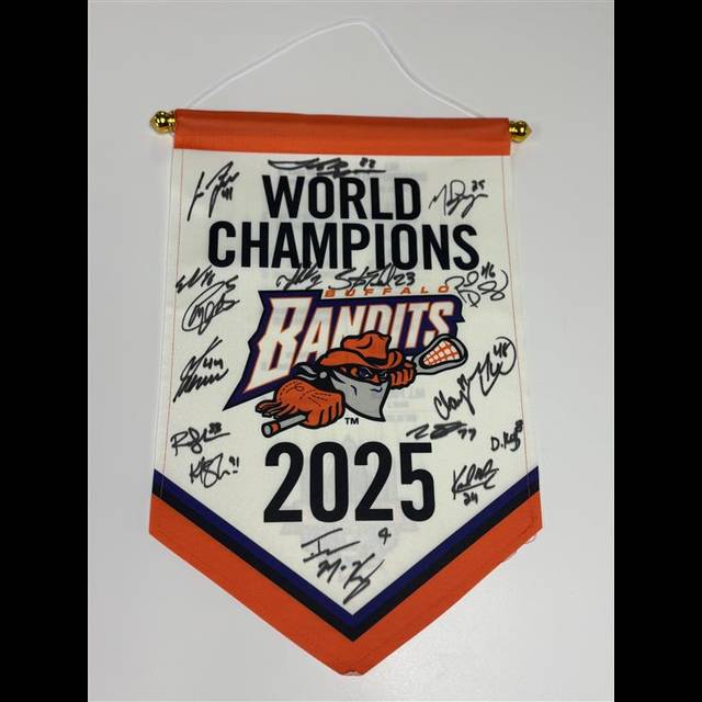 A pennant banner with orange and navy blue colors featuring the Bandits logo and "World Champions 2025" text, covered with multiple signatures from team members.