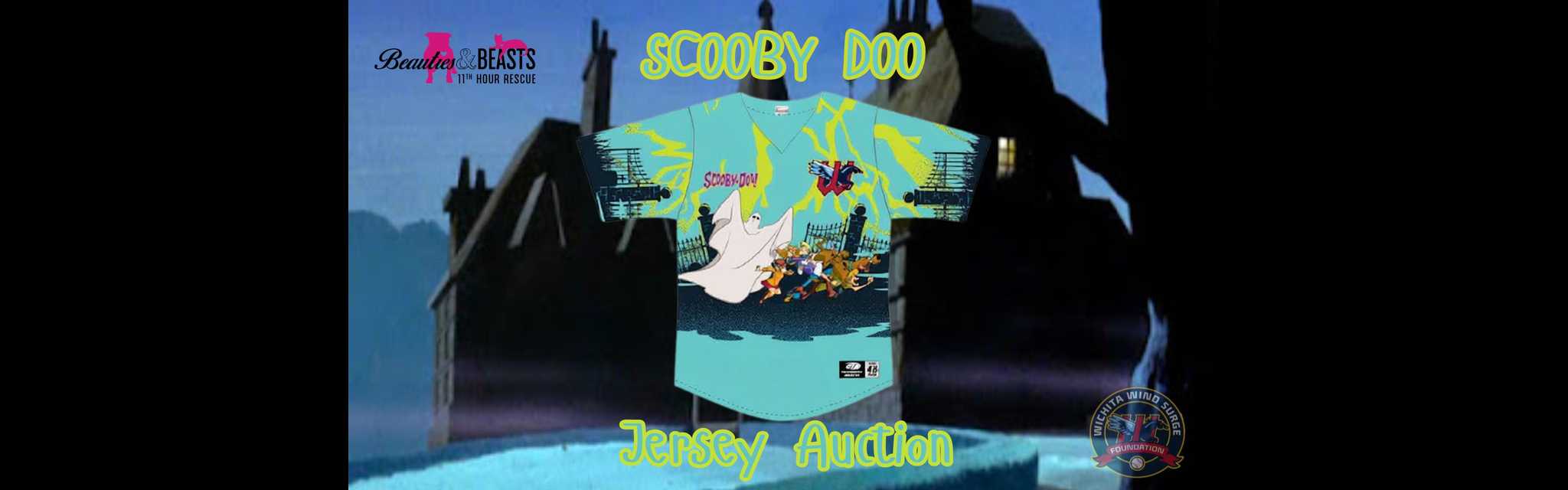 Turquoise Scooby-Doo jersey displayed against a haunted mansion backdrop, featuring cartoon characters and a ghost, promoting a jersey auction.
